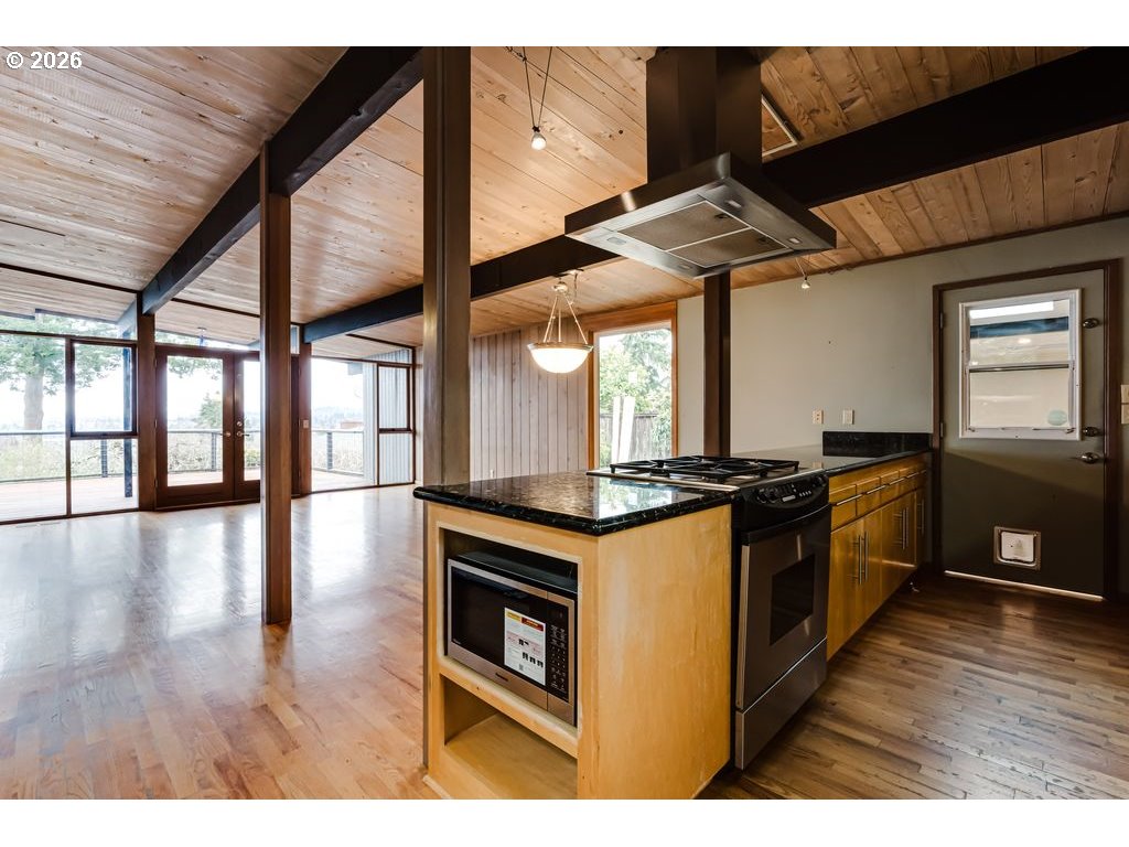 2055 Broadview Street Eugene, OR 97405 - Photo 17 of 45 a kitchen with stainless steel appliances granite countertop a stove and a wooden floors