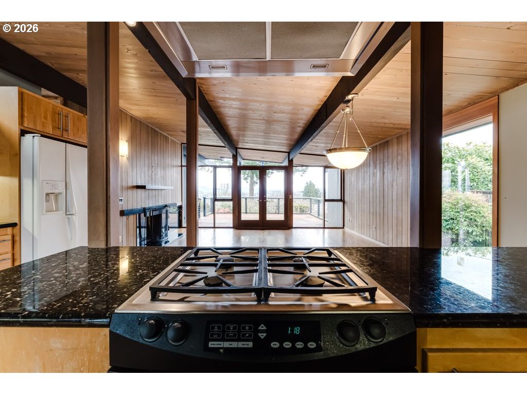 2055 Broadview Street Eugene, OR 97405 - Photo 18 of 45 a kitchen with a stove a sink and a refrigerator
