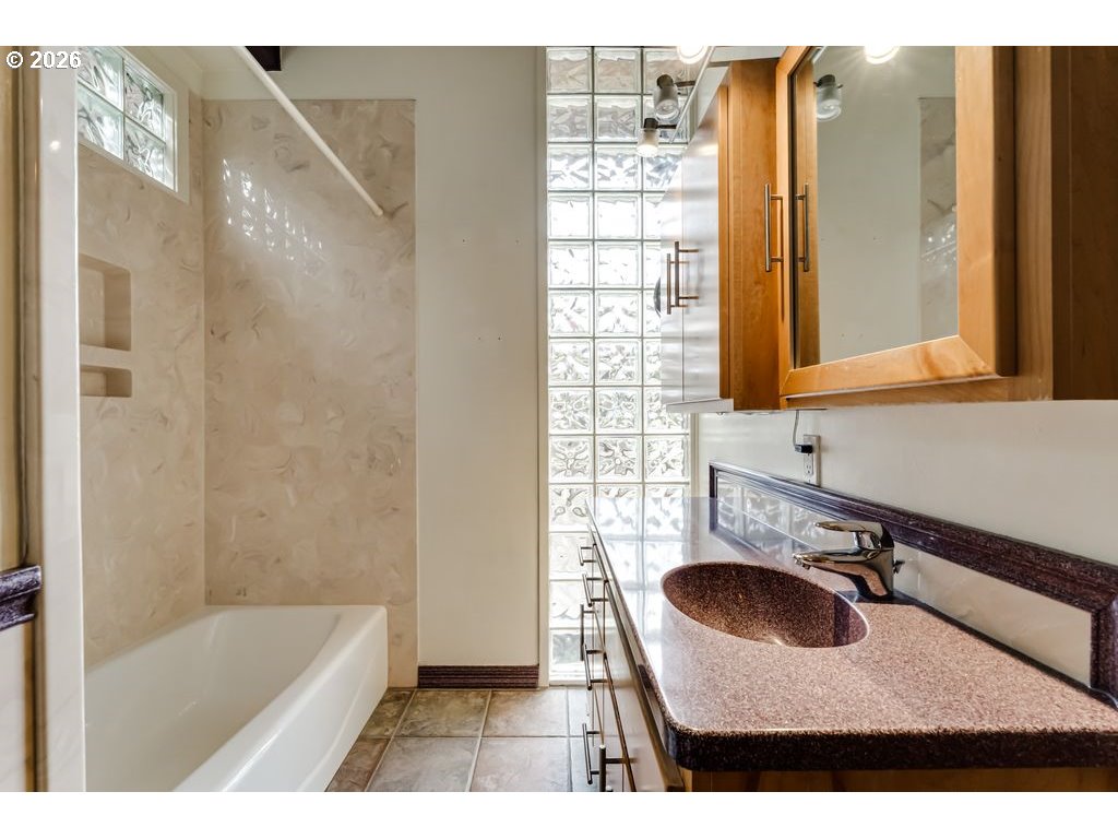 2055 Broadview Street Eugene, OR 97405 - Photo 23 of 45 a bathroom with a sink a bathtub and a sink