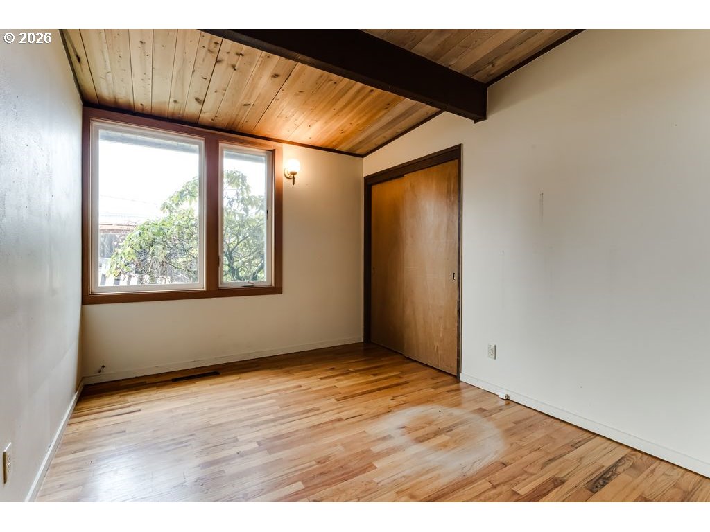 2055 Broadview Street Eugene, OR 97405 - Photo 25 of 45 an empty room with wooden floor and windows