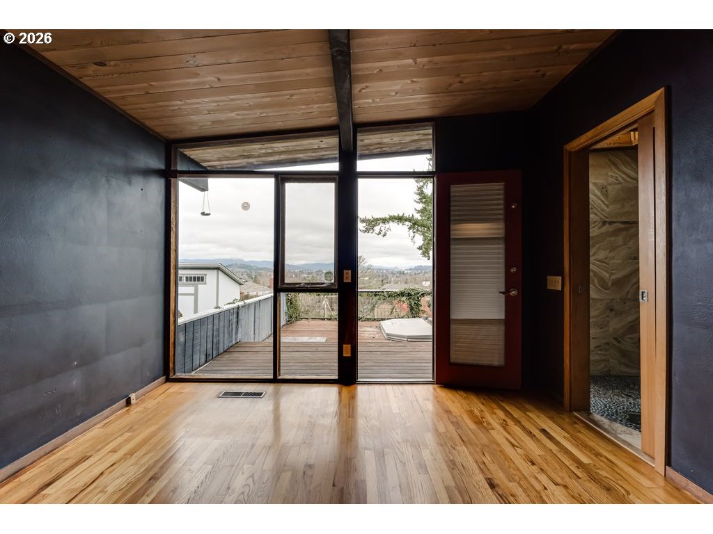 2055 Broadview Street Eugene, OR 97405 - Photo 27 of 45 a view of an empty room with wooden floor and a window