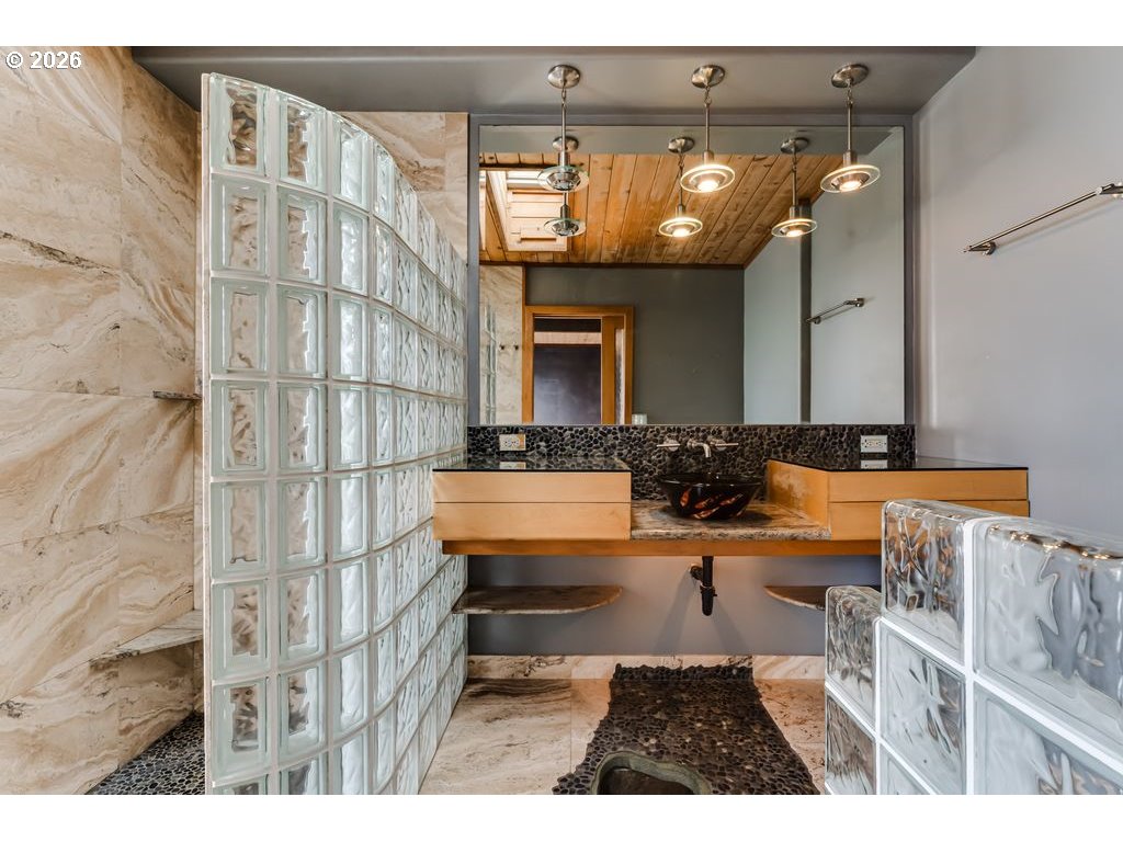 2055 Broadview Street Eugene, OR 97405 - Photo 30 of 45 a bathroom with a sink a mirror and a shower
