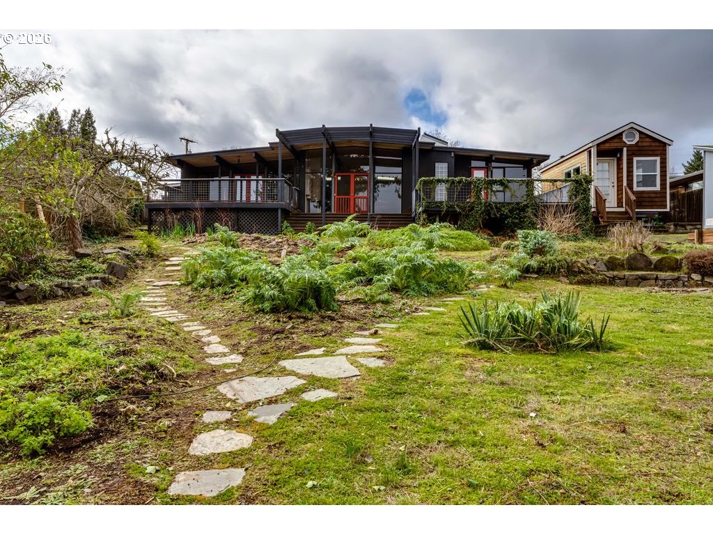 2055 Broadview Street Eugene, OR 97405 - Photo 40 of 45 a view of a house with a big yard and large trees
