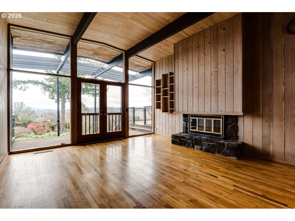 2055 Broadview Street Eugene, OR 97405 - Photo 7 of 45 a view of an empty room with wooden floor and a window