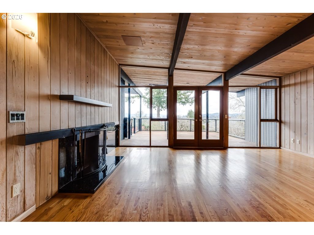 2055 Broadview Street Eugene, OR 97405 - Photo 10 of 45 a view of an empty room with wooden floor and a window