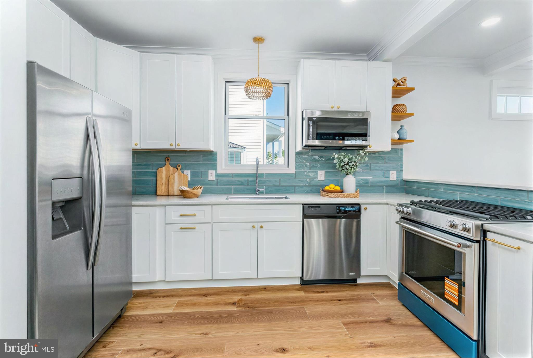 7214 Greenbank Road Middle River, MD 21220 - Photo 17 of 65 a kitchen with stainless steel appliances a stove a refrigerator and a microwave