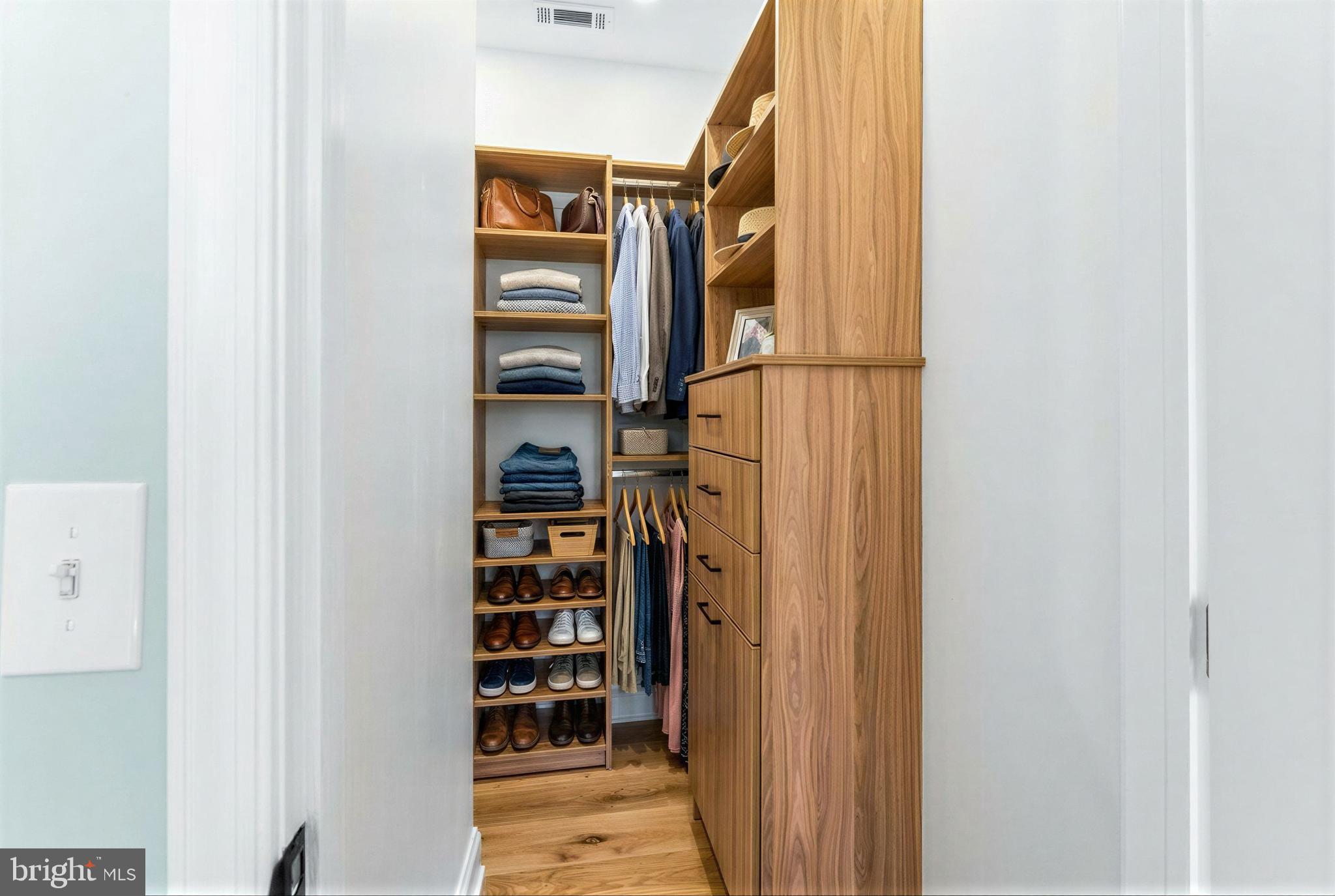 7214 Greenbank Road Middle River, MD 21220 - Photo 47 of 65 a view of walk in closet with empty racks