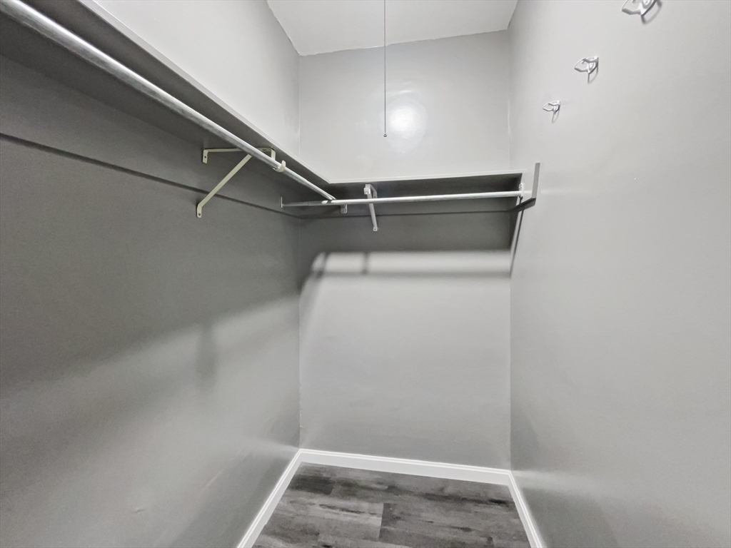 140 Chestnut Street, Unit 706 Springfield, MA 01103 - Photo 15 of 23 a view of a room with racks on the wall