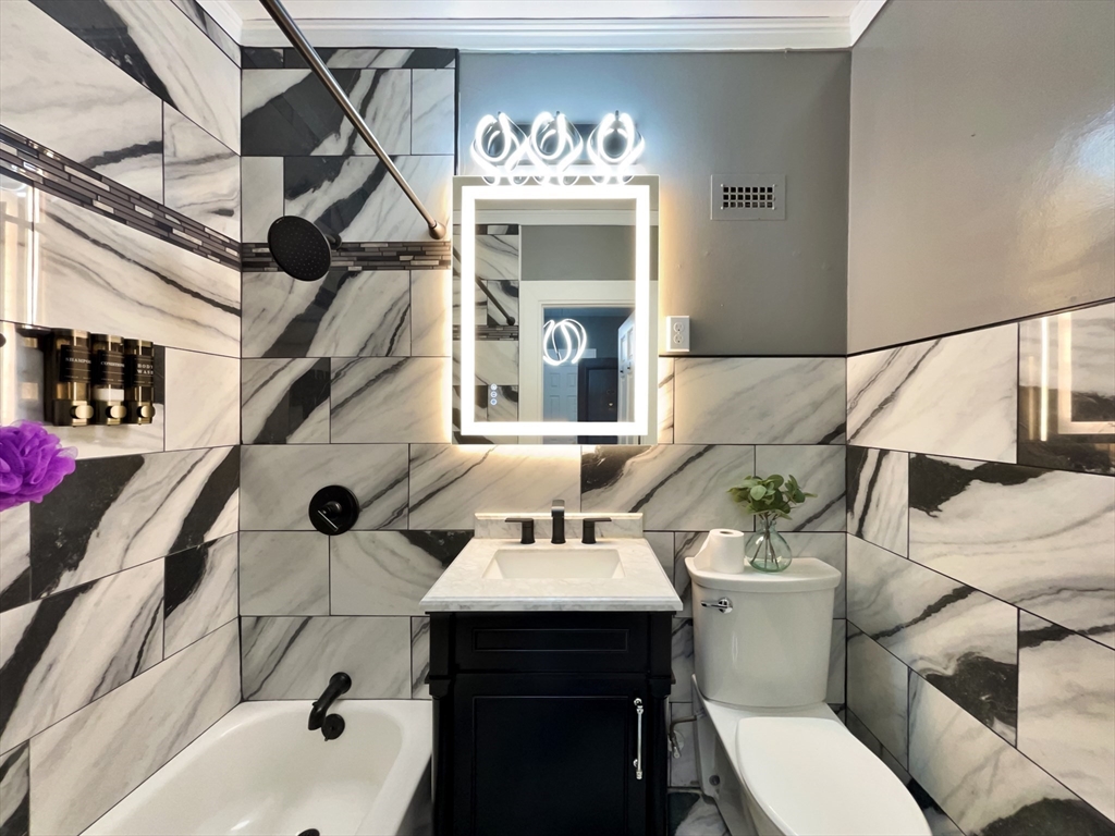 140 Chestnut Street, Unit 706 Springfield, MA 01103 - Photo 17 of 23 a bathroom with a sink and a mirror