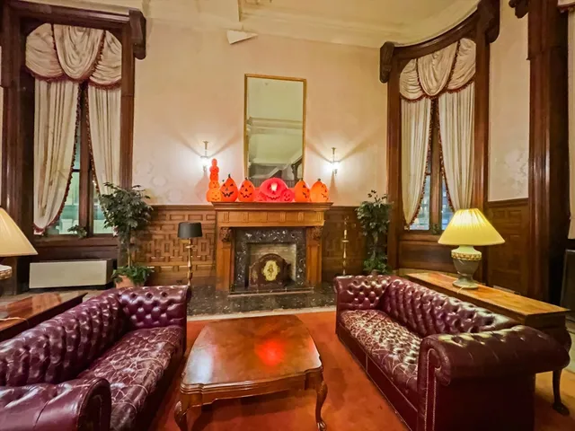 a living room with furniture a window and a fireplace