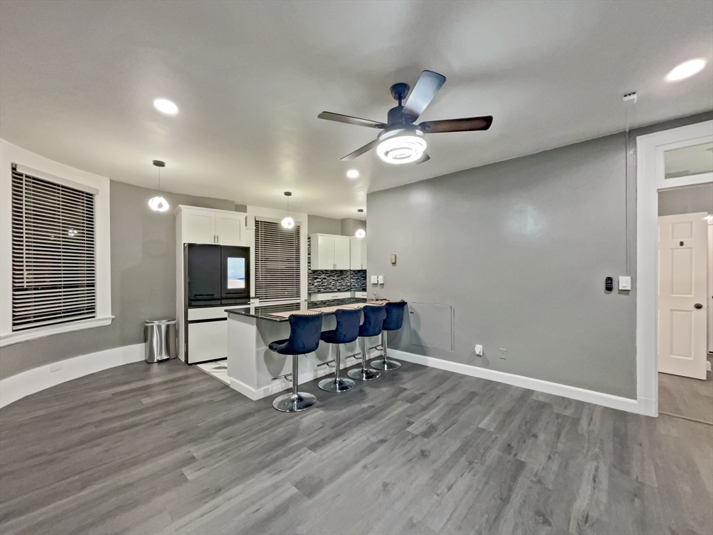 140 Chestnut Street, Unit 706 Springfield, MA 01103 - Photo 8 of 23 a view of a workspace with furniture and a kitchen