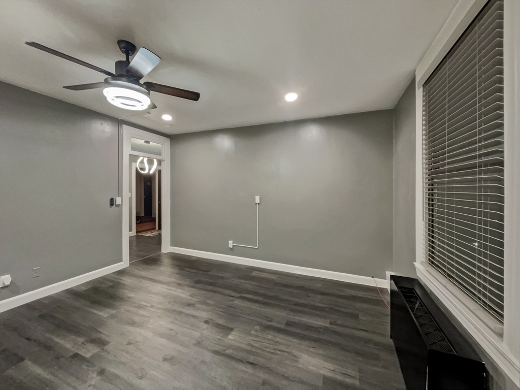 140 Chestnut Street, Unit 706 Springfield, MA 01103 - Photo 9 of 23 a view of an empty room with wooden floor