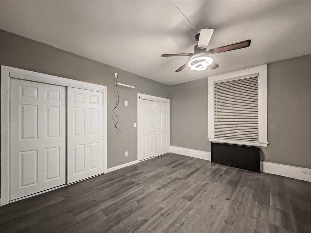 140 Chestnut Street, Unit 706 Springfield, MA 01103 - Photo 10 of 23 wooden floor in an empty room with a window