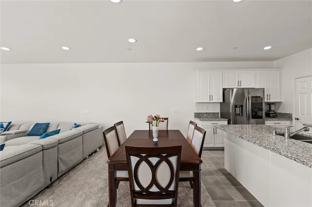 a view of kitchen and dining area with furniture