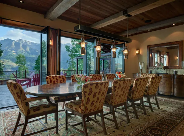a view of a dining room with furniture window and outside view