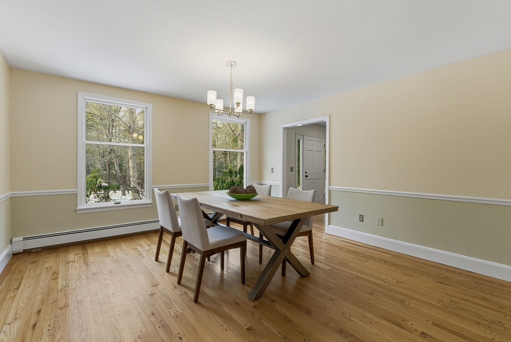75 Barre Road Hubbardston, MA 01452 - Photo 17 of 42 a view of a dining room with furniture and wooden floor