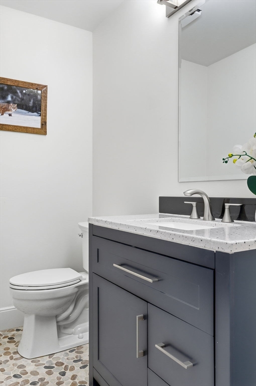 75 Barre Road Hubbardston, MA 01452 - Photo 23 of 42 a bathroom with a granite countertop toilet sink and mirror