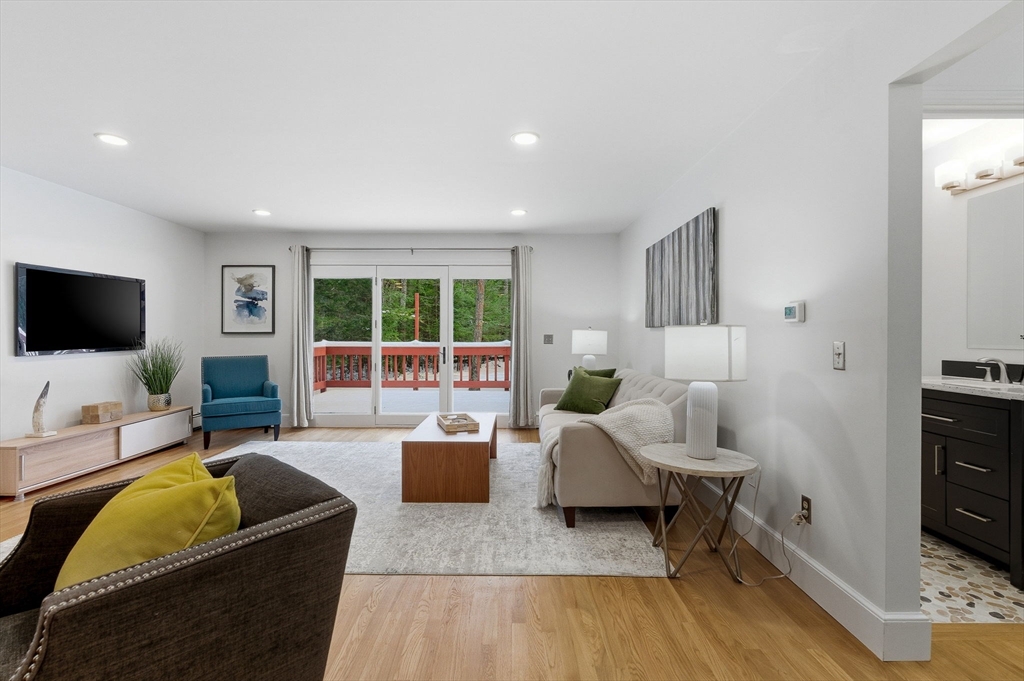 75 Barre Road Hubbardston, MA 01452 - Photo 25 of 42 a living room with furniture and a flat screen tv