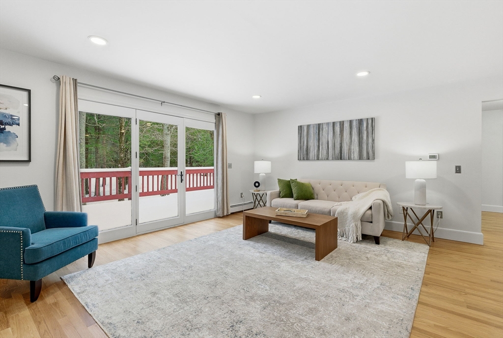 75 Barre Road Hubbardston, MA 01452 - Photo 26 of 42 a living room with furniture and a large window