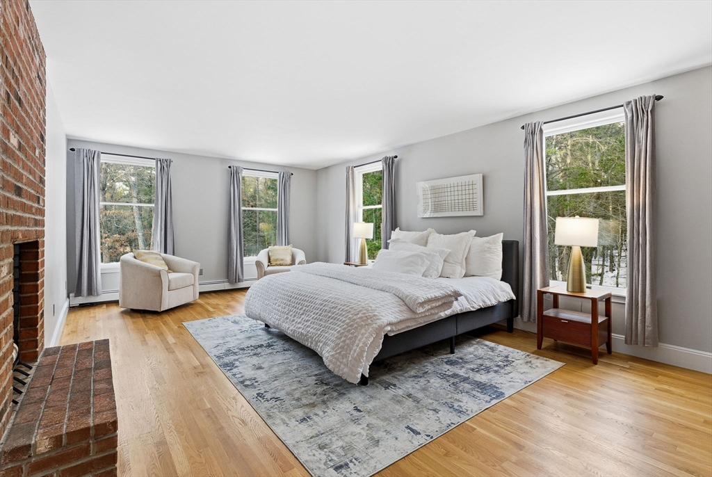 75 Barre Road Hubbardston, MA 01452 - Photo 28 of 42 a bedroom with a large bed couch and a window