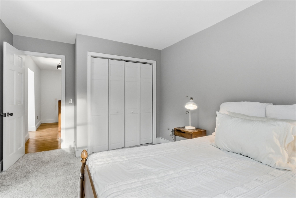 75 Barre Road Hubbardston, MA 01452 - Photo 38 of 42 a bedroom with a bed and a lamp