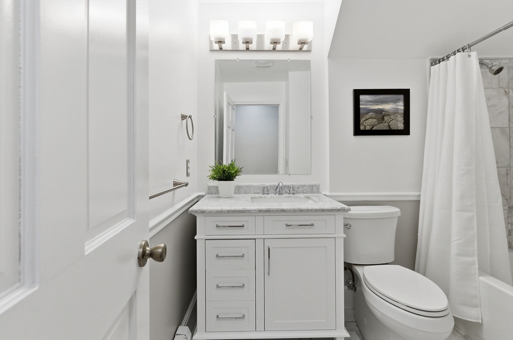 75 Barre Road Hubbardston, MA 01452 - Photo 39 of 42 a bathroom with a granite countertop toilet sink and mirror