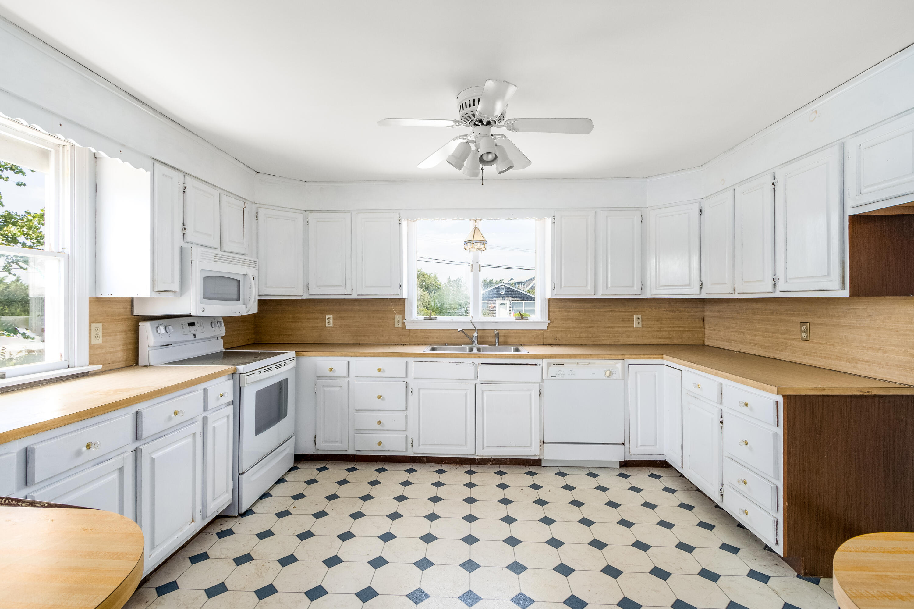 32 North Shore Blvd Extension Sandwich, MA 02537 - Photo 19 of 28 a kitchen with a cabinets window and white stainless steel appliances