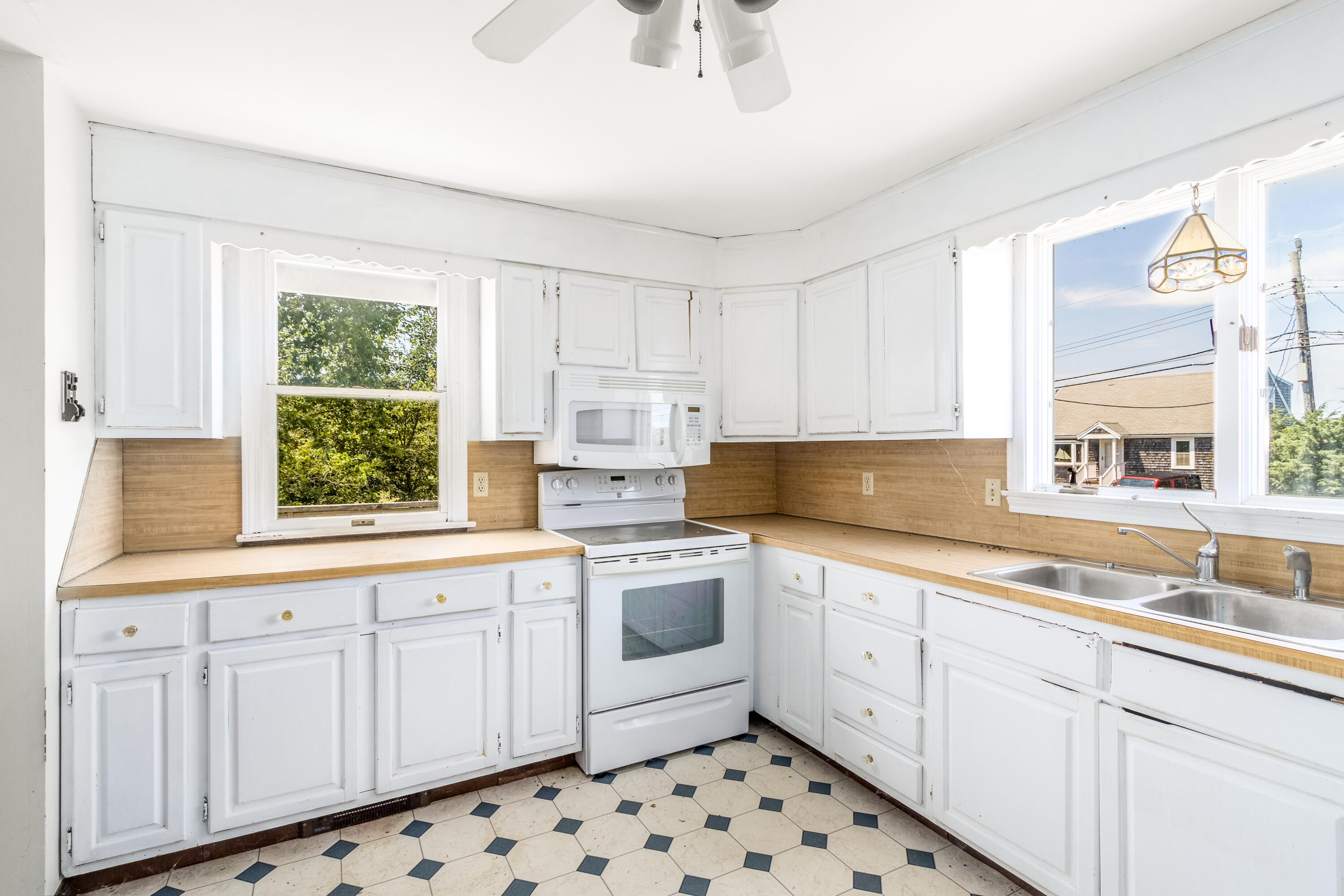 32 North Shore Blvd Extension Sandwich, MA 02537 - Photo 20 of 28 a kitchen with white cabinets a window and appliances