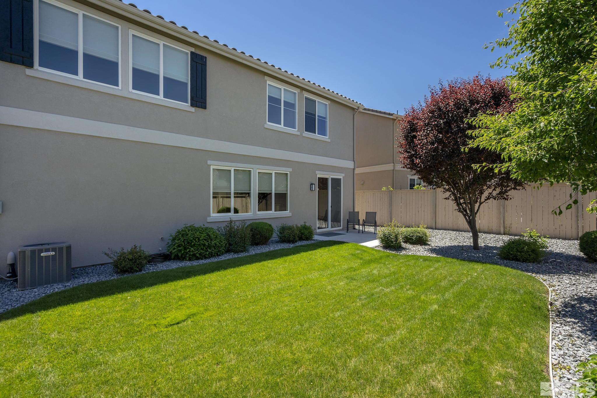 10819 Walnut Ridge Drive Reno, NV 89521 - Photo 11 of 22 front view of a house with a yard