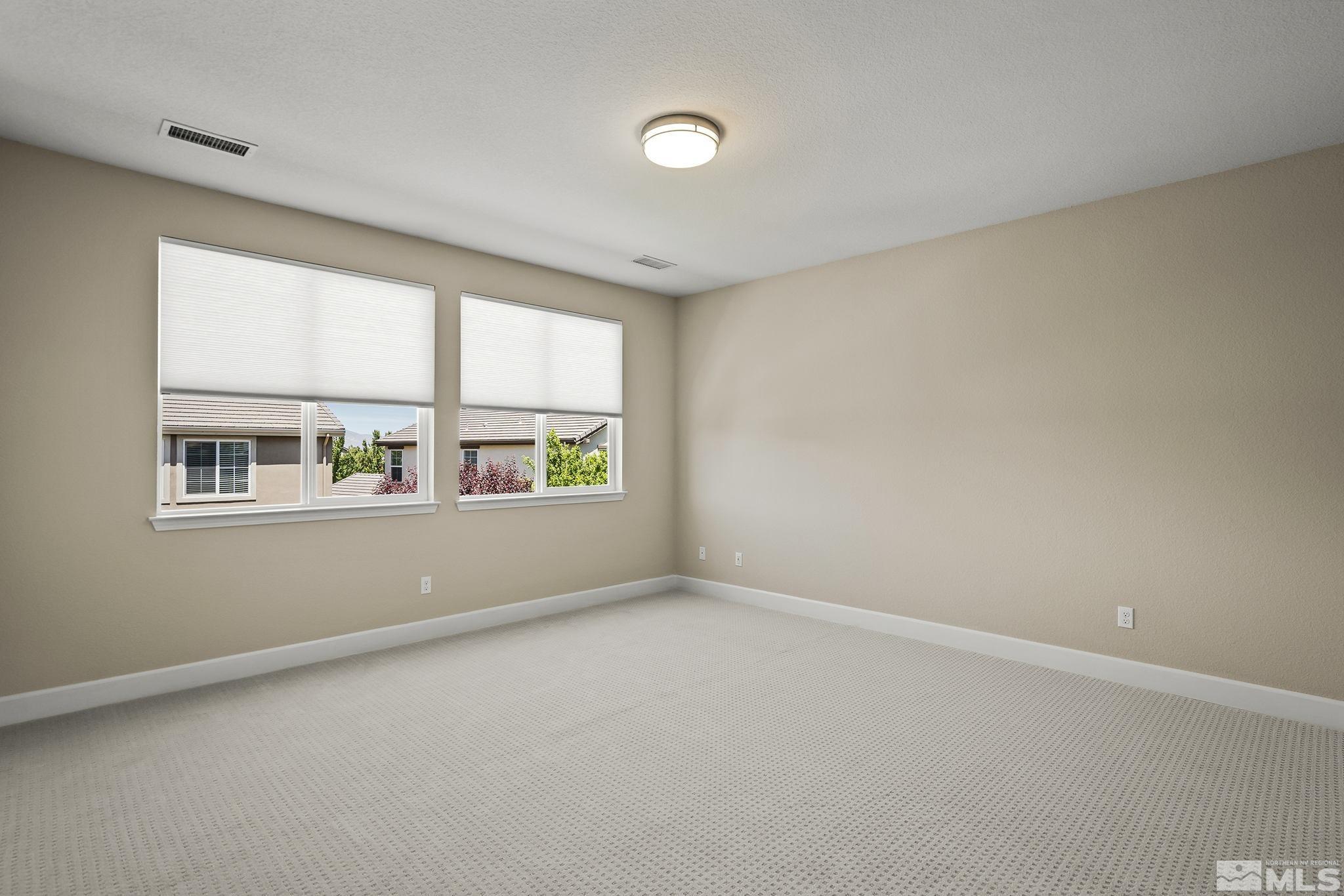 10819 Walnut Ridge Drive Reno, NV 89521 - Photo 12 of 22 an empty room with windows