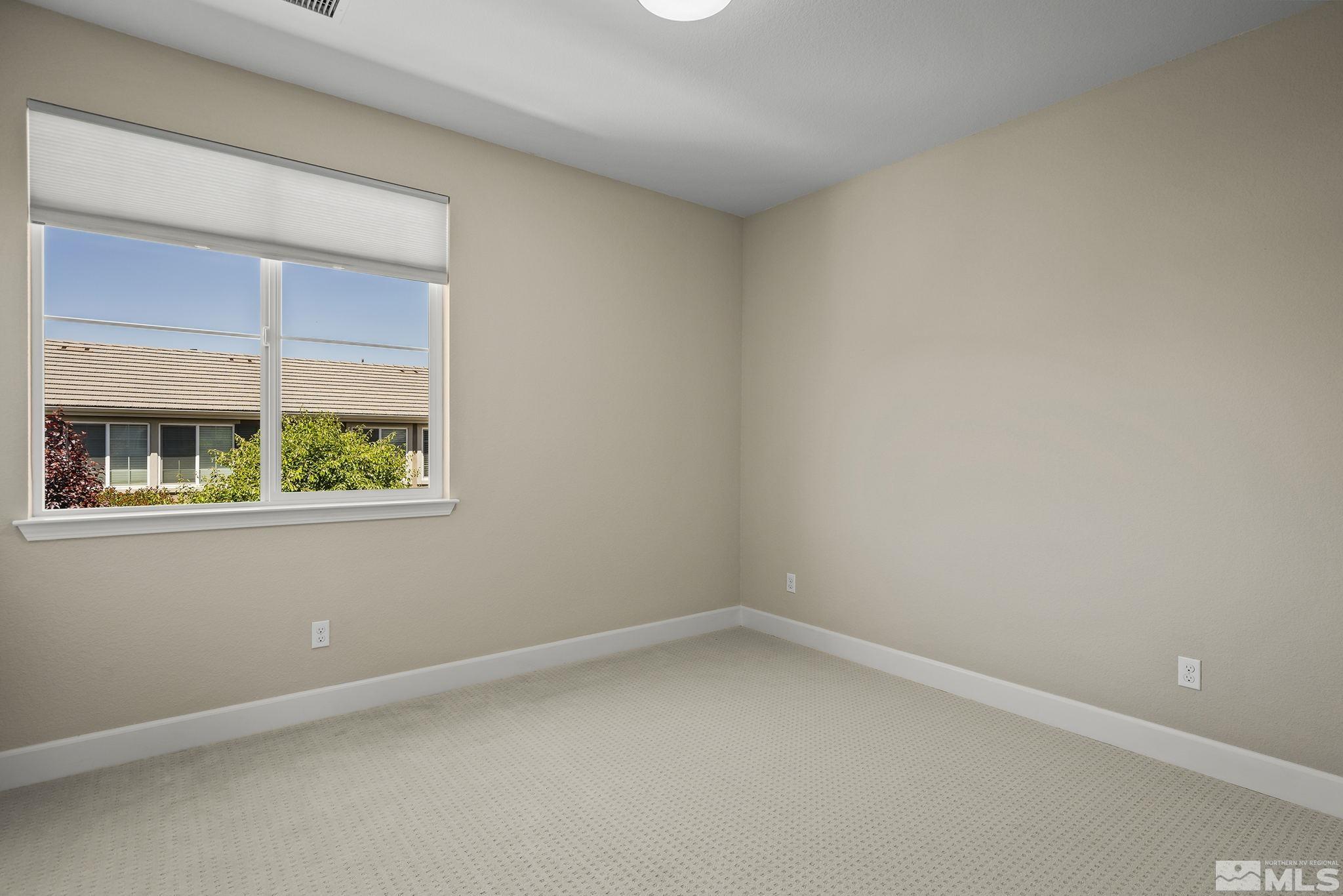 10819 Walnut Ridge Drive Reno, NV 89521 - Photo 15 of 22 an empty room with a window