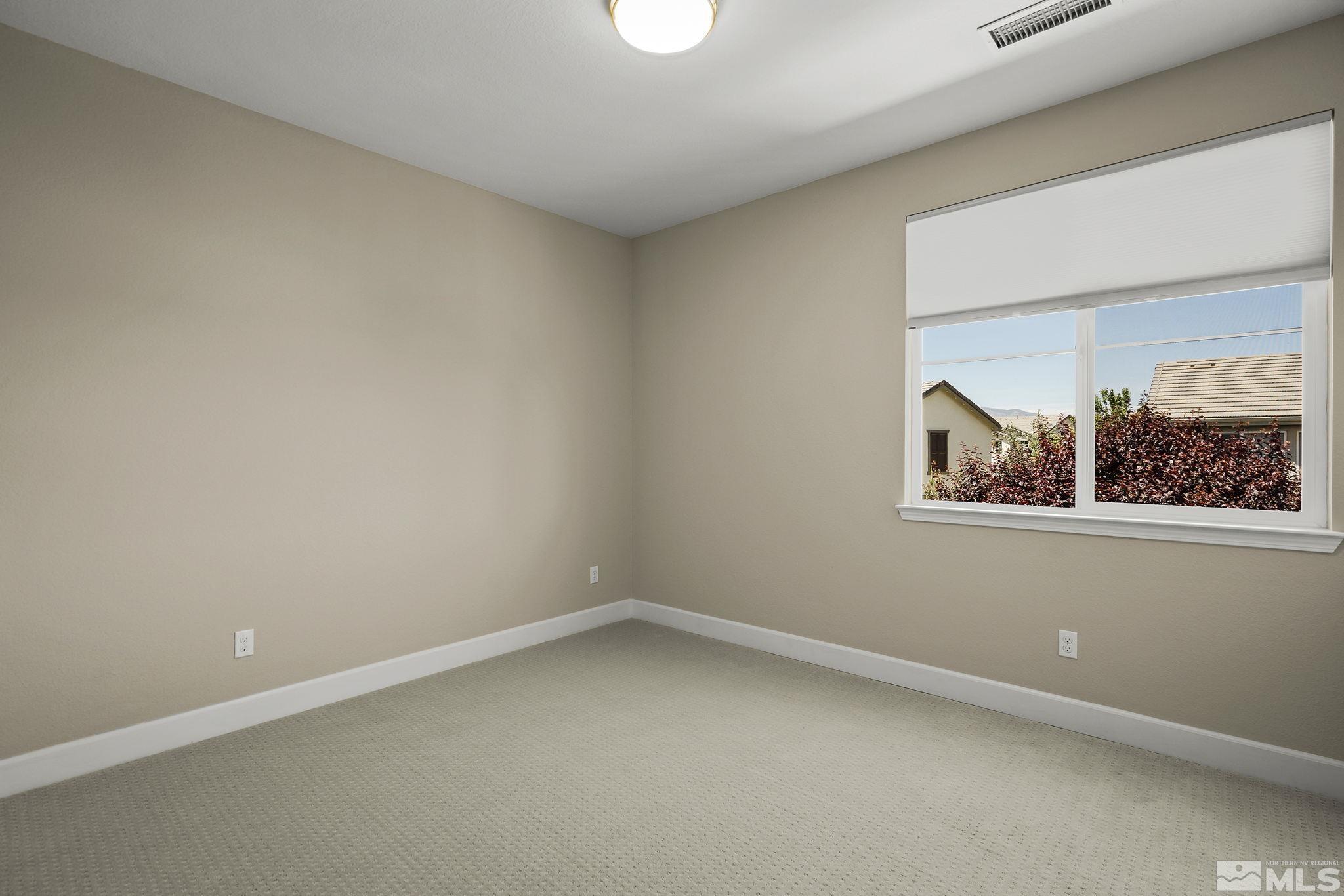 10819 Walnut Ridge Drive Reno, NV 89521 - Photo 17 of 22 an empty room with a window