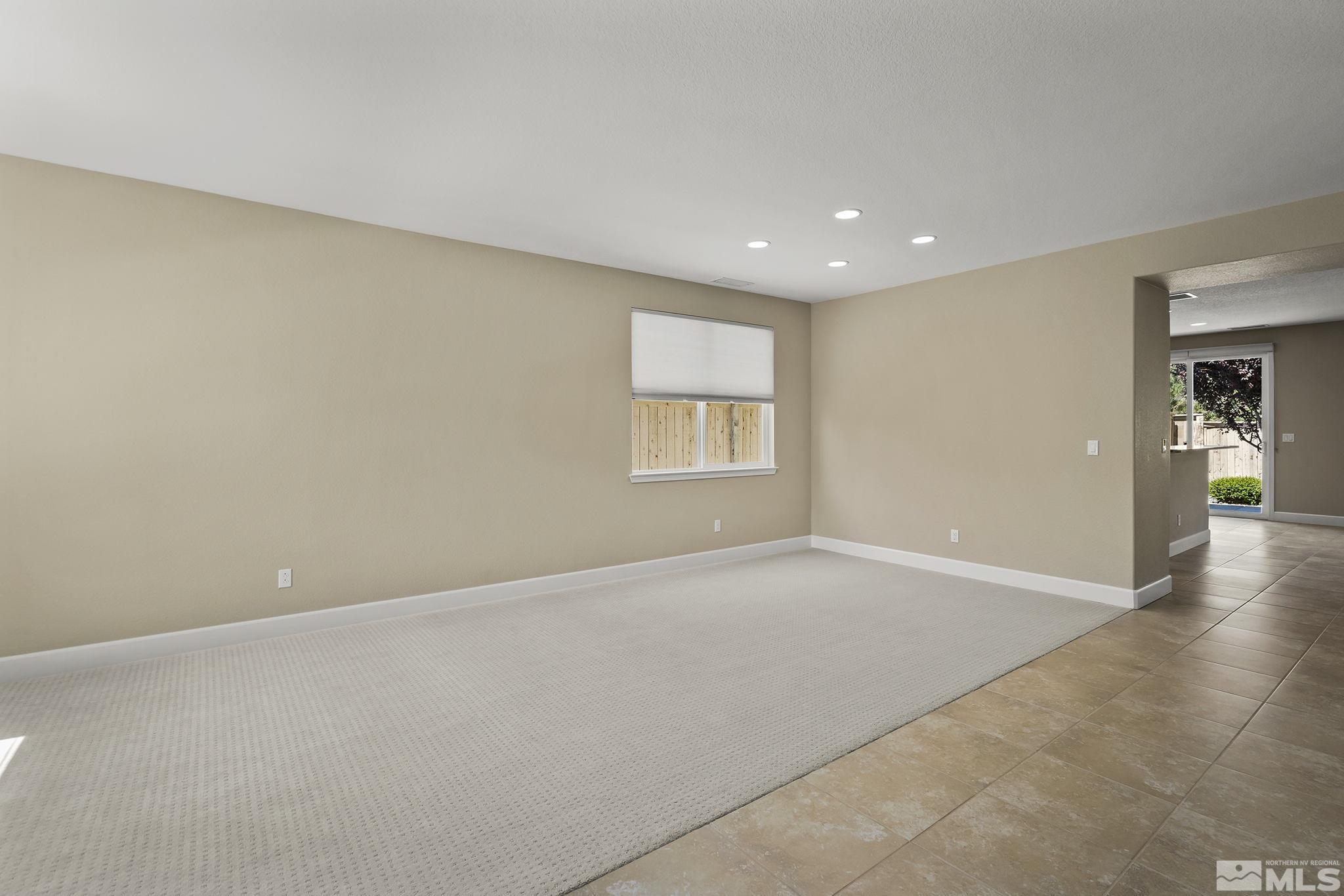 10819 Walnut Ridge Drive Reno, NV 89521 - Photo 19 of 22 a view of an empty room with a window