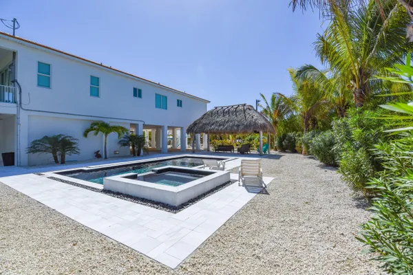 a view of a swimming pool with a patio