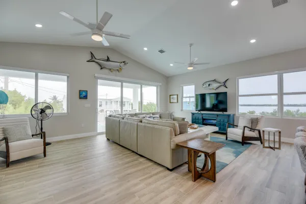 a kitchen with lots of counter top space and living room