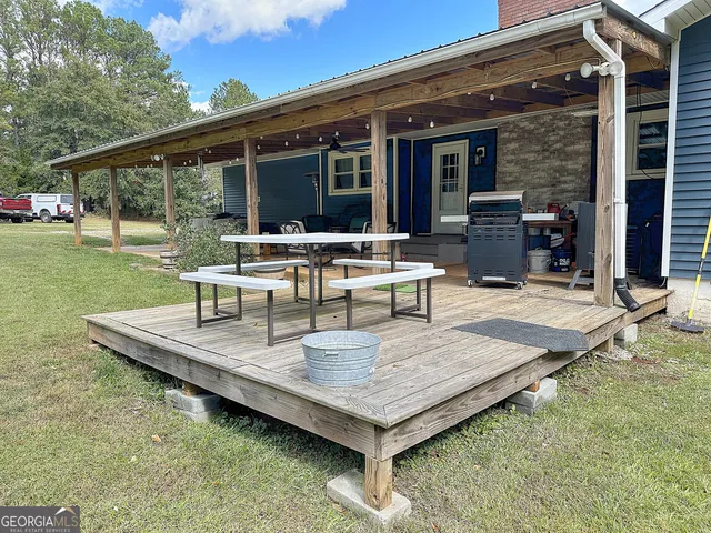 a view of a backyard with a patio