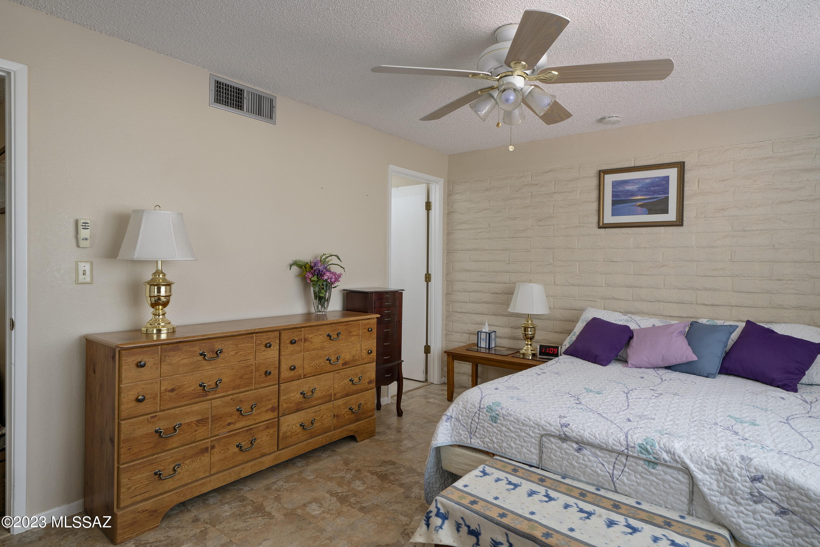 670 South Pantano Road, Unit E Tucson, AZ 85710 - Photo 10 of 17 a bedroom with a bed and a dresser