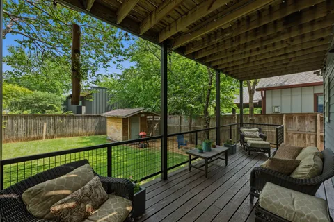 a view of a couches in the deck under a large umbrella