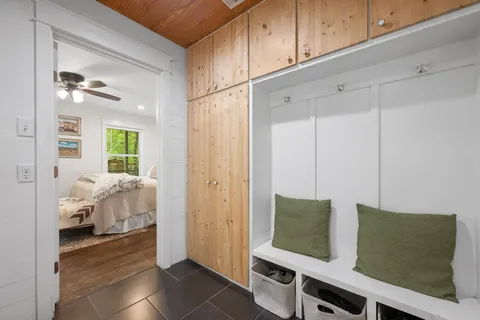 a bedroom with furniture and window
