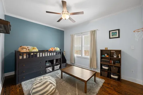 a bedroom with furniture and a window