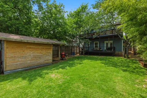 a view of a house with a backyard