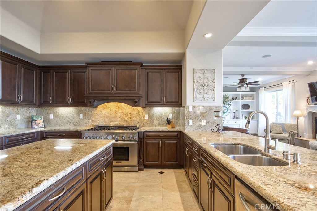 44195 Vía Horca Temecula, CA 92590 - Photo 16 of 74 a kitchen with stainless steel appliances granite countertop a sink stove and cabinets