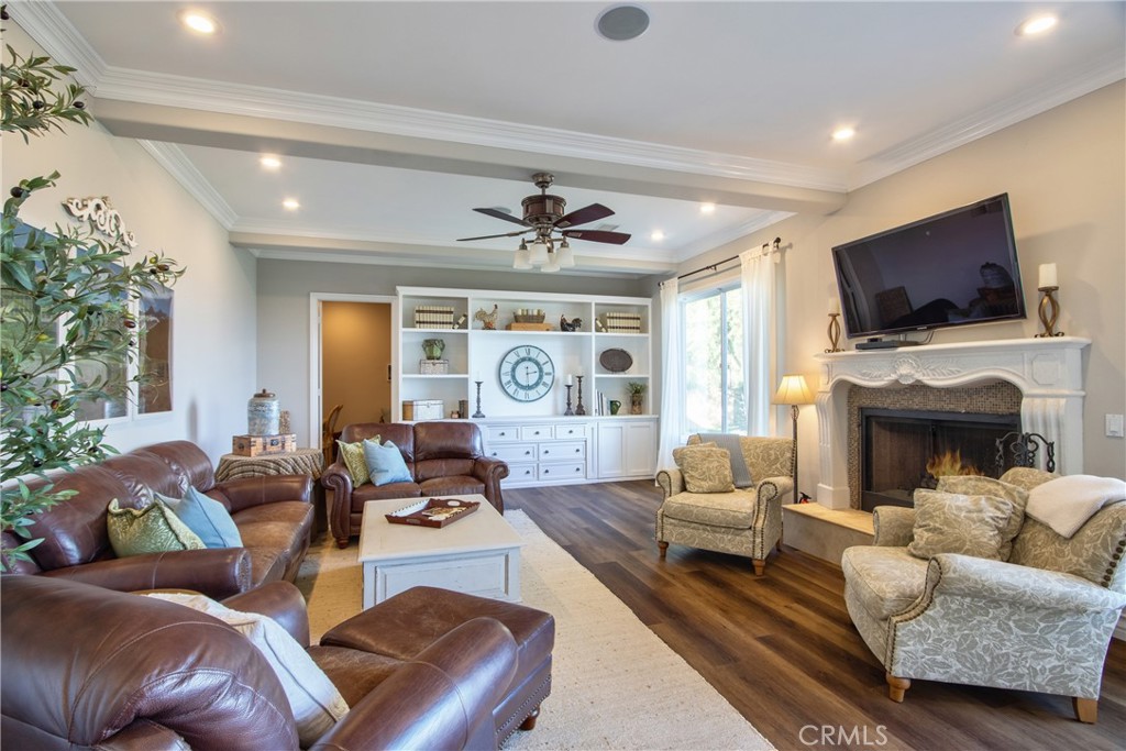 44195 Vía Horca Temecula, CA 92590 - Photo 19 of 74 a living room with fireplace furniture and a flat screen tv