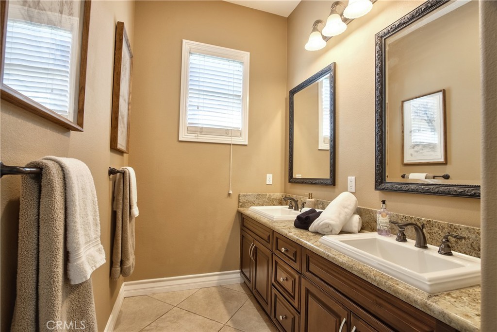 44195 Vía Horca Temecula, CA 92590 - Photo 34 of 74 a bathroom with double vanity and a mirror