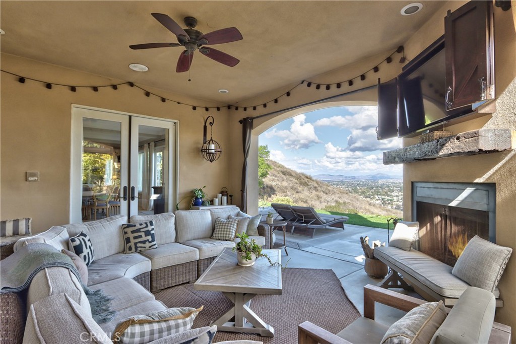 44195 Vía Horca Temecula, CA 92590 - Photo 51 of 74 a living room with furniture ceiling fan and a large window