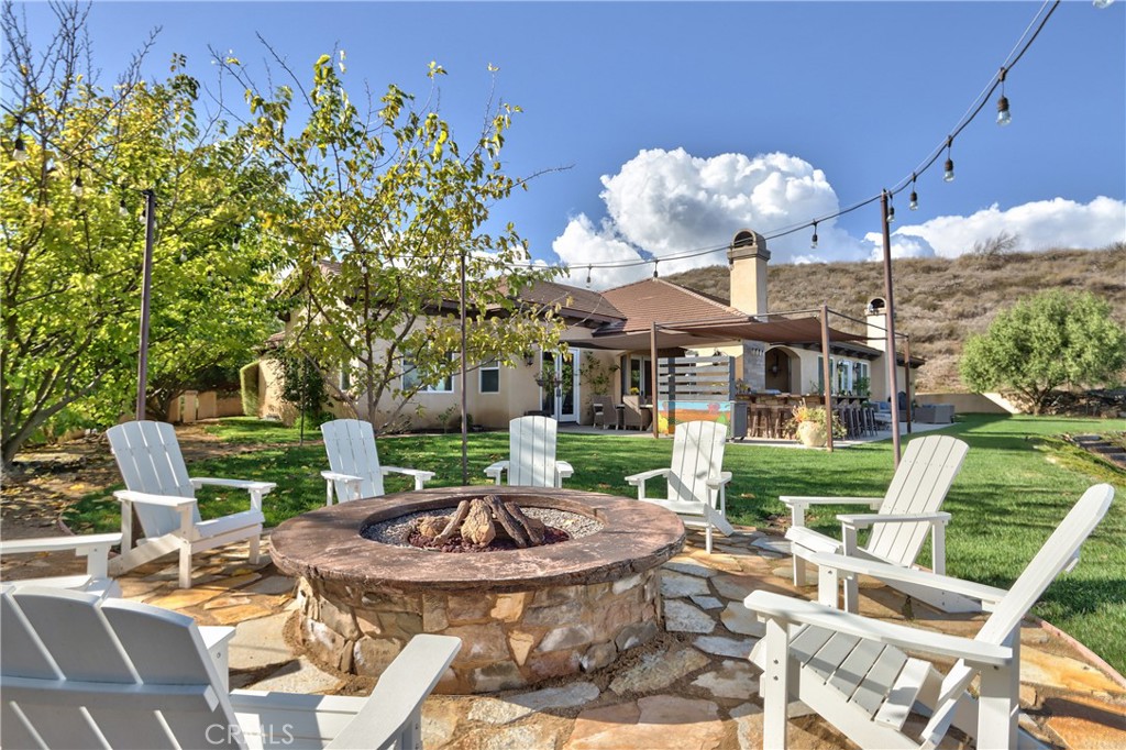 44195 Vía Horca Temecula, CA 92590 - Photo 59 of 74 a view of a patio with table and chairs potted plants with wooden floor