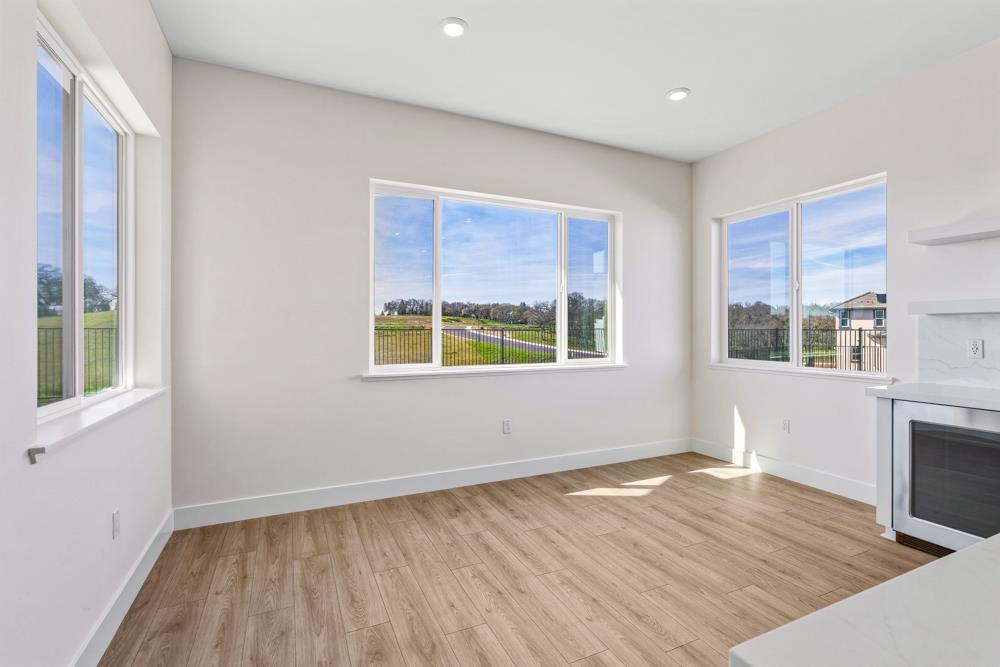 14838 Grace Warren Way Rancho Murieta, CA 95683 - Photo 11 of 18 a view of empty room with wooden floor and fan