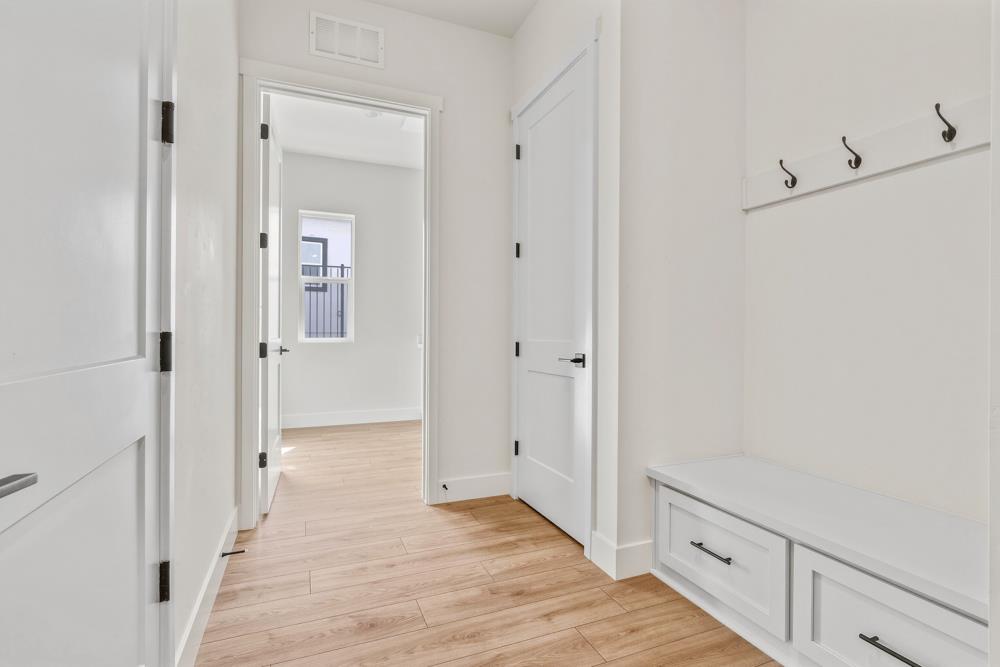 14838 Grace Warren Way Rancho Murieta, CA 95683 - Photo 17 of 18 a view of a hallway with wooden floor