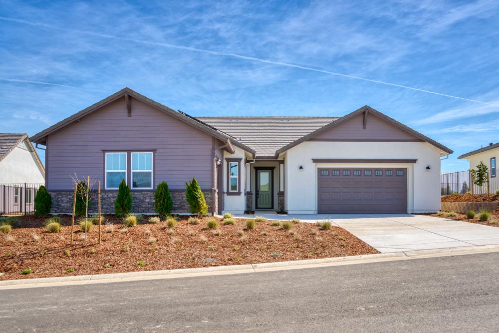 14838 Grace Warren Way Rancho Murieta, CA 95683 - Photo 2 of 18 a front view of a house with yard and garage