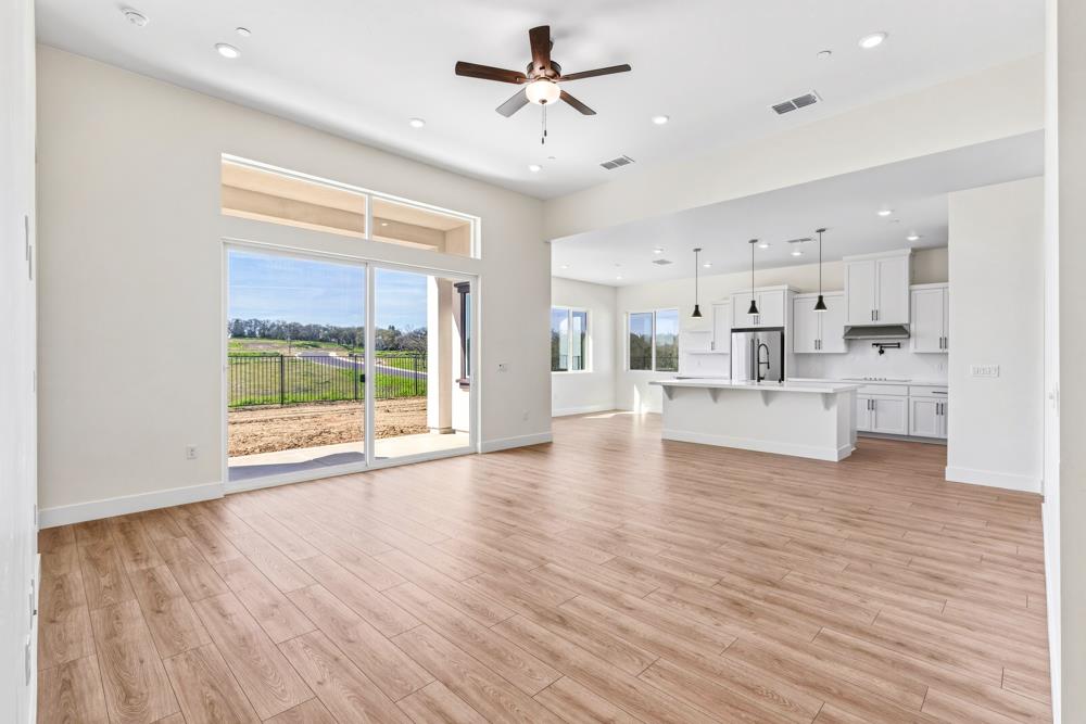 14838 Grace Warren Way Rancho Murieta, CA 95683 - Photo 3 of 18 a view of kitchen with wooden floor and window